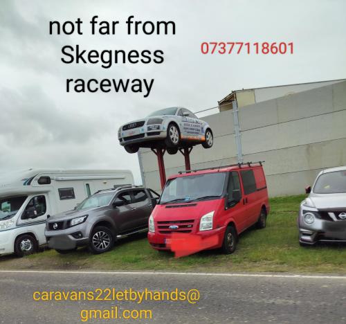 a car on a stand in a group of parked cars at Ingoldmells Skegness holiday break at coral beach by Hannah in Lincolnshire