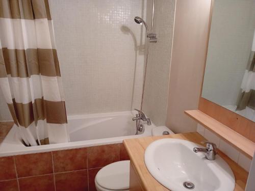a bathroom with a sink and a toilet and a shower at Apartment in Termignon with Ski-In Ski-Out in Val Cenis
