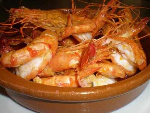 a bowl full of shrimp with sauce on it at Hotel Ohm Patt in Boppard