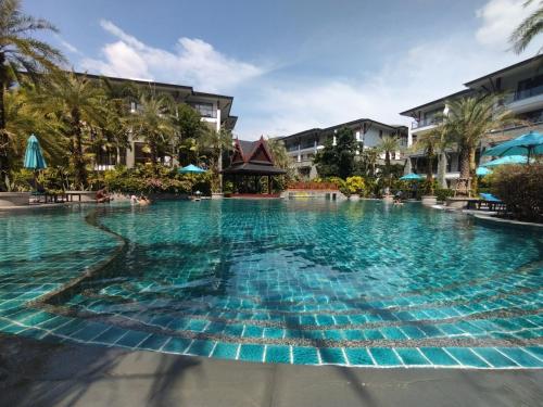a large swimming pool at a resort at Suite of Naithon beachfront apartment in Nai Thon Beach