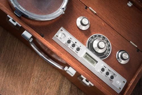a wooden box with a musical instrument on a table at attitude on granville in Hong Kong