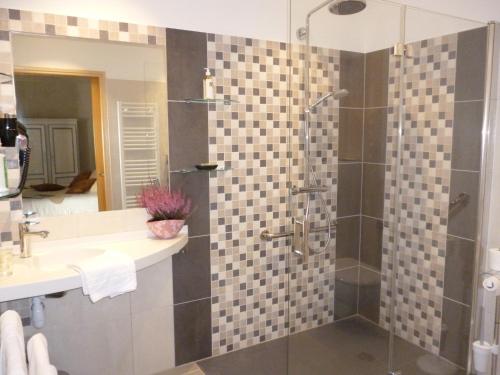 a bathroom with a shower and a sink at Hôtel Picardia in Saint-Valery-sur-Somme