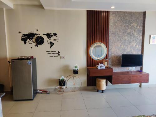 a room with a tv and a mirror on the wall at Studio Murree facing apartment In Bahria Enclave in Islamabad