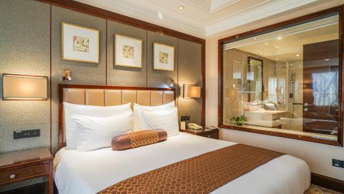Postel nebo postele na pokoji v ubytování Xian heng Hotel