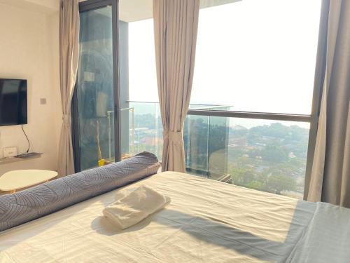 Un ou plusieurs lits dans un hébergement de l'établissement Andromeda Seaview Condo Near Beach