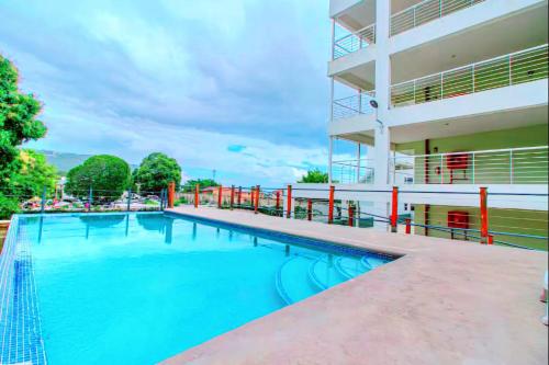 a swimming pool in front of a building at The Soul of Kingston Chic 2BR Condo with Pool and GYM in Kingston