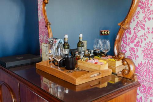 a table with wine glasses and wine bottles on it at Yarra Valley Grand in Yarra Glen