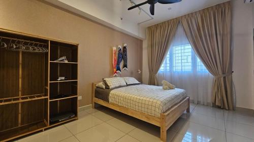 a bedroom with a bed and a large window at Setia Alam Edu Sentral 27 in Shah Alam