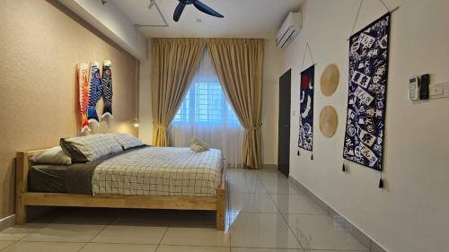 a bedroom with a bed and a window at Setia Alam Edu Sentral 27 in Shah Alam