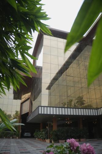 a large building with a lot of windows at MARZA INN in Kalpetta
