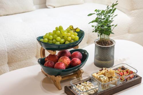 a table with two bowls of fruit on a table at Longji Thousand - layer Terraces View Hotel in Longsheng