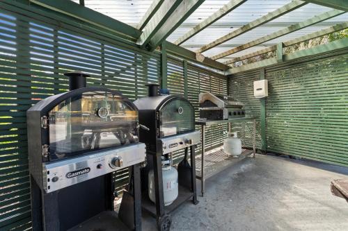 a kitchen with an old stove in a building at Tasman Holiday Parks - Miranda in Miranda