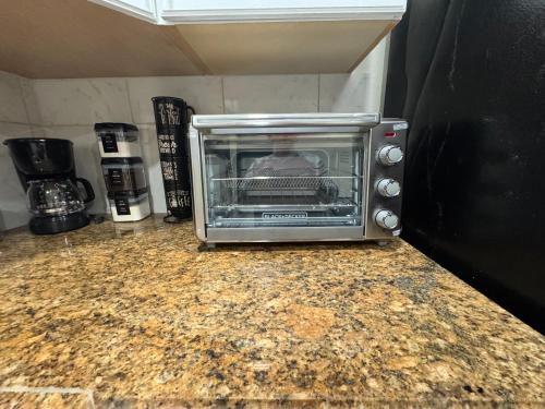 a toaster oven sitting on top of a counter at Sunshine Nest in Lehigh Acres