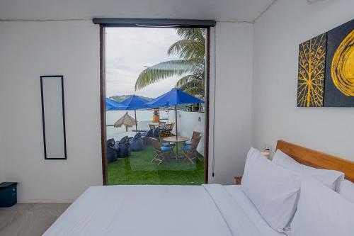 Ένα ή περισσότερα κρεβάτια σε δωμάτιο στο The Cove Bali