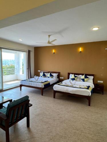 Postel nebo postele na pokoji v ubytování Wonder Mist Resort, Mahabaleshwar