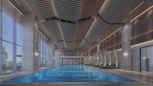 a large swimming pool inside of a building at 开芯国际大酒店 in Guangzhou