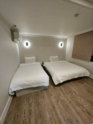 Hotel Myeongjiにあるベッド