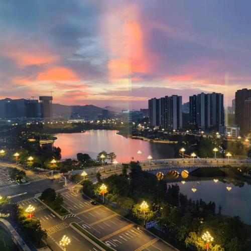 a city at night with a river and buildings at 开芯国际大酒店 in Guangzhou