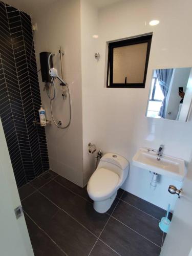 a bathroom with a toilet and a sink at The Horizon by MyKey in Ipoh