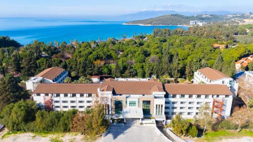 an aerial view of a hotel with the ocean in the background at PROXIMA HOTEL Kuşadası in Kusadası