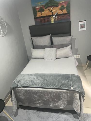 Ένα ή περισσότερα κρεβάτια σε δωμάτιο στο Executive Guesthouse