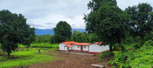 a small house in the middle of a field at Entire Private Farm on Rent 2 Acre with 3 Room, it's Kittu's Farm in Saralgaon