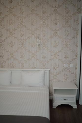 Ένα ή περισσότερα κρεβάτια σε δωμάτιο στο UBA Accommodation Aparthotel
