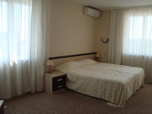 Postel nebo postele na pokoji v ubytování Hotel Astra