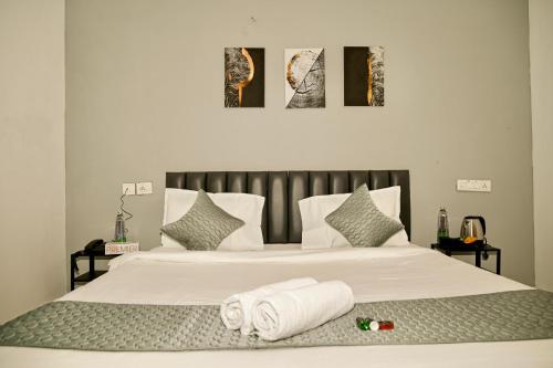 Postel nebo postele na pokoji v ubytování Bee Oak Budget Hotel