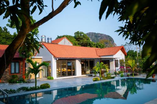 an image of a villa with a swimming pool at Tam Coc Minh Quan Homestay in Ninh Binh