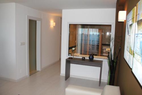 a bathroom with a sink and a mirror at Hotel Playas de Torrevieja in Torrevieja