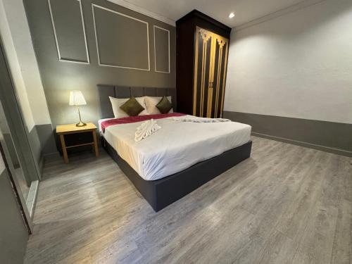Katil atau katil-katil dalam bilik di Zephyr House Residence