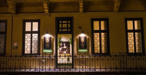 a building with windows with candles on them at Leo Boutique Rooms - Adults Only in Budapest