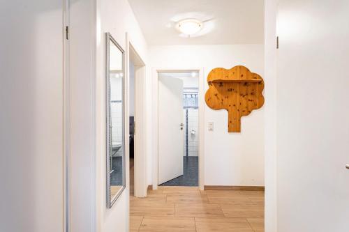 a hallway with a wooden heart on the wall at Fewo Zur Piste in Willingen