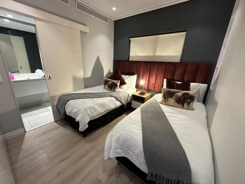 Letto o letti in una camera di Urban Elephant 16 On Bree
