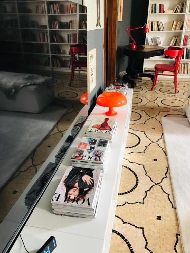 a table with books on it in a living room at Donna Franca in Lecce