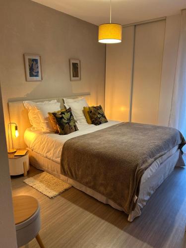 a bedroom with a large bed in a room at Niort Home in Niort
