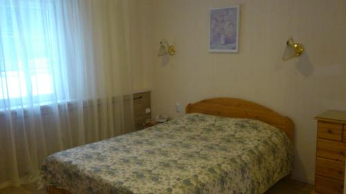Voodi või voodid majutusasutuse Pansionaat Valentina toas