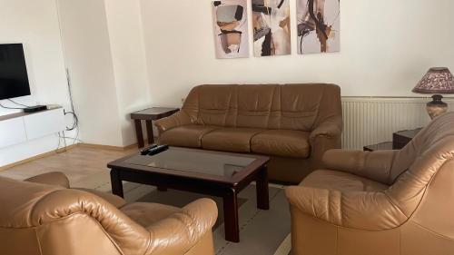 a living room with two couches and a coffee table at BT Lux apartment 2 in Skopje