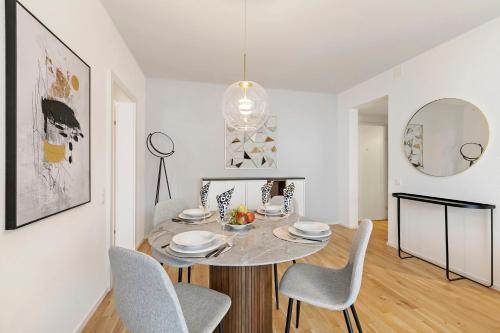 a dining room with a table and chairs at Novos Contrada in Lugano