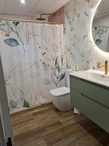 a bathroom with a shower curtain and a sink at Villa Ainara Aguadulce in Aguadulce