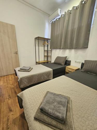 Ένα ή περισσότερα κρεβάτια σε δωμάτιο στο Beach Apartment B