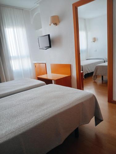 Postel nebo postele na pokoji v ubytování Torrejoven