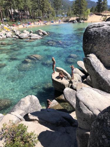 a group of people standing on rocks near a river at Experience the Beauty of Tahoe from Your Zephyr Cove Retreat! #2 in Zephyr Cove