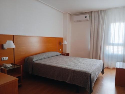 Postel nebo postele na pokoji v ubytování Torrejoven