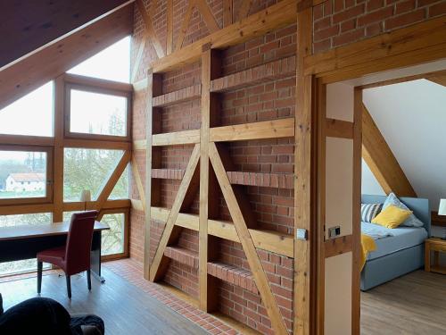 a brick wall in a room with a dining room at Ruheoase in Fürstenzell in Fürstenzell