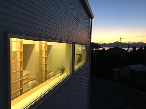 a house with a window on the side of it at SHIMAGO SURFRIDER - Vacation STAY 85442v in Amakusa