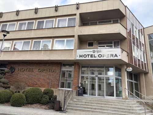 a building with a hotel operator sign on it at Hotel Opera in Jaroměřice na Rokytné