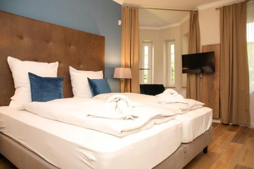 Ένα ή περισσότερα κρεβάτια σε δωμάτιο στο Ferienwohnungen "Burg Freienstein"