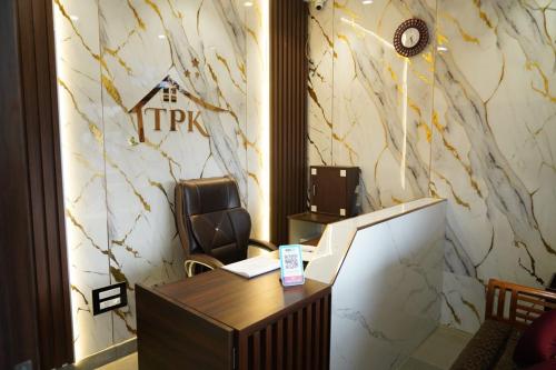 an office with a desk and a chair in a room at TPK Residency in Thanjāvūr